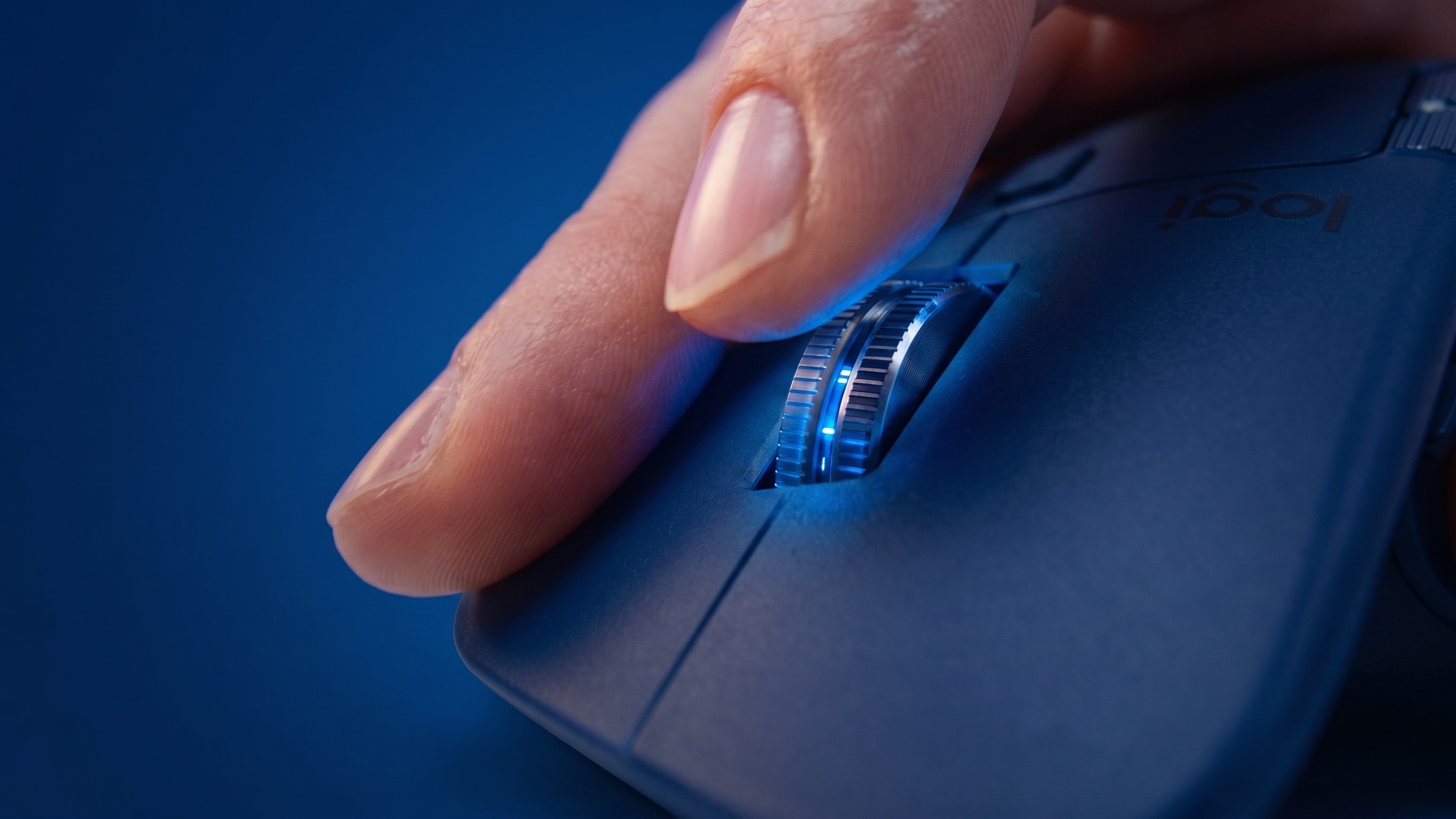 Index finger on the MagSpeed scroll wheel of an MX Master
